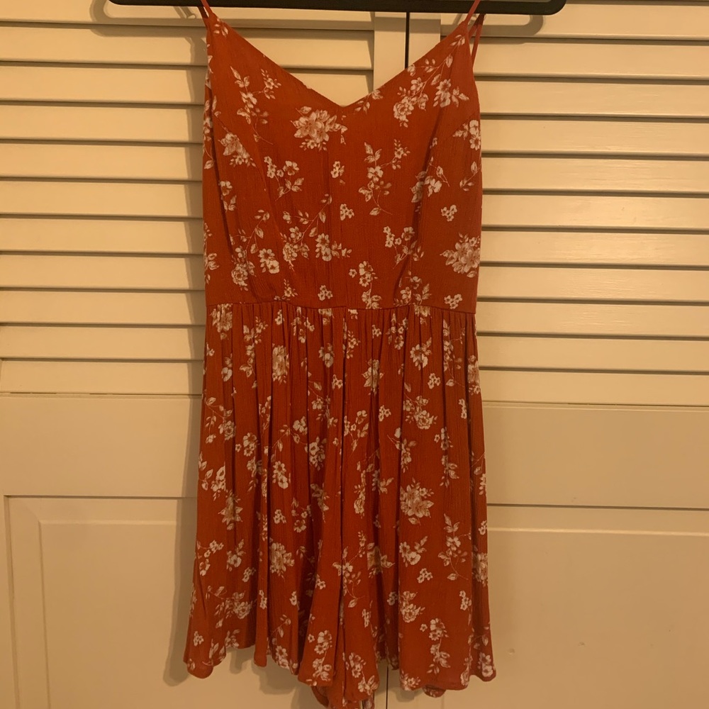 Orange and white floral romper